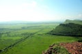 View of the mountain range and a beautiful valley from the top of a high hill Royalty Free Stock Photo