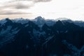 View on mountain range in snow in Alps in sunrise