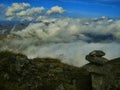 View from mountain range to the valley above fog and clouds Royalty Free Stock Photo