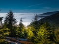 View from mountain range to the valley above fog and clouds Royalty Free Stock Photo