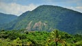 View of the mountain rock formation from Praia da Mococa on sunny day