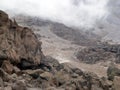 A view of the mountain slopes covered with landslides of stones and soil after a rock fall