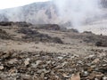 A view of the mountain slopes covered with landslides of stones and soil after a rock fall