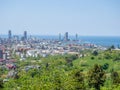 View from the mountain to the modern city. Beautiful cityscape. from above. City by the sea