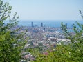 View from the mountain to the modern city. Beautiful cityscape. City by the sea