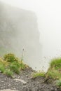 view of a mountain trail during a very misty and cloudy summer day high up in the Swiss alps. Bachsee lake trail in Grindelwald Royalty Free Stock Photo
