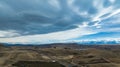 Agricultural fields and rural farming country on the shores of Lake Tekapo under dramatic cloudscape