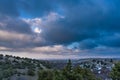 View from the mountain on winter landscape with dramatic dark grey sky