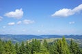 View of the mountains with beautiful clouds on the way to the Pysanyj stone. Carpathians