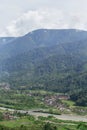 View of the mountains below the river slope and the village Royalty Free Stock Photo