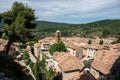 View on mountains cliff, old houses, green valley in remote medieval village Moustiers-Sainte-Marie in Provence, France Royalty Free Stock Photo