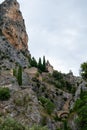 View on mountains cliff, old houses, green valley in remote medieval village Moustiers-Sainte-Marie in Provence, France Royalty Free Stock Photo