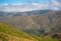 View at the mountains with a curve dirt road