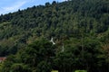 The view of the mountains of Dieng with a building in a mosque in the village