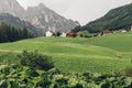 A view of the mountains and houses in the Alpine dolomites Royalty Free Stock Photo