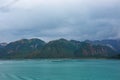 A view of mountains and icebergs in the Wrangell National Park outside of Hubbard Glacier Alaska from a cruise ship Royalty Free Stock Photo