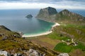 View of mountains and sandy beach, Lofoten, Norway