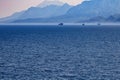 View of mountains and ships in a blue haze off the Mediterranean coast. Antalya, Turkey Royalty Free Stock Photo