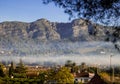 View of mountains and spanish village in the valley in morning mist Royalty Free Stock Photo