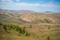 View with mountains and valley from top of the rock - damn finger - in the mountainous Altai, Russia