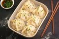view Mouthwatering manti dumplings captured in alluring presentation on dark