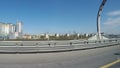 View from the moving car on the modern speedway with portly signs and signs with names of streets in Russian