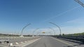 View from the moving car on the modern speedway with portly signs and signs with names of streets in Russian