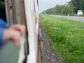 View of moving-pass-by natural wildflowers and weeds while traveling by train Royalty Free Stock Photo