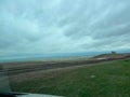 The view of the muddy road from a RV Sprinter Van stuck in the mud in the Wall, SD boondocking spot in Badlands National Park Royalty Free Stock Photo