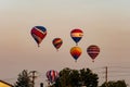 View of Multiple Multi Colored Hot Air Balloons Floating in a Beautiful Morning Blue Sky