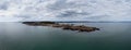 View of the Mumbles headland with the historic lighthouse and piers in Swansea Bay Royalty Free Stock Photo