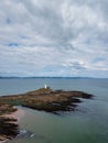 View of the Mumbles Lighthouse in Swansea Bay at low tide Royalty Free Stock Photo