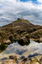 View of the Mumbles Lighthouse in Swansea Bay at low tide Royalty Free Stock Photo