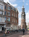 View of Munttoren tower on Muntplein, from along the banks of the river Amstel Royalty Free Stock Photo