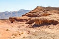 View on Mushroom and a half rock surrounded by rocky mountains in Timna National Park in Aravah Valley desert in Southern Israel