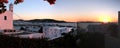 View of Mykonos, windmill and old port from a house at sunset Royalty Free Stock Photo