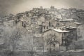 View of mysterious medieval village with fog and snow in winter season, Abruzzo