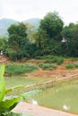 View of the Nam Khan river, Louangphabang, Laos. Copy space for text. Vertical. Royalty Free Stock Photo