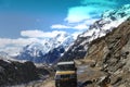 view of the narrow broken road with cars leading towards Zero point passing through the mountain