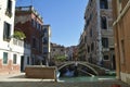 Venice, Italy, October 2021: View of a narrow canal surrounded by old brick houses in Venice. Royalty Free Stock Photo