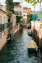 View of a narrow canal in Venice with a boat moored on a side Royalty Free Stock Photo