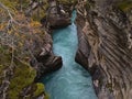 View of narrow canyon with flowing river at famous Athabasca Falls in Jasper National Park, Alberta, Canada. Royalty Free Stock Photo