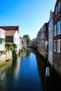 View on narrow dutch water canal with residential houses on both sides against blue summer sky - Dordrecht, Netherlands Royalty Free Stock Photo