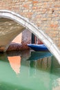 View of the narrow side of the canal, stone bridge, Venice, Italy Royalty Free Stock Photo