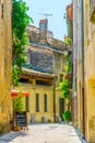 View of a narrow street in the center of Uzes, France