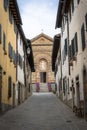 View of the narrow street facing the Church of Santa Maria in Panzano in Chianti, Tuscany, Italy Royalty Free Stock Photo