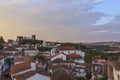 View of narrow streets and castle of Obidos from wall of fortress. Scenic old town with medieval architecture in the sunset. White Royalty Free Stock Photo