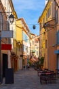 Narrow streets in French town of Hyeres in summer day