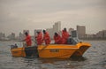 SHARK`S BOARD, DURBAN, KWA-ZULU NATAL, SOUTH AFRICA - HANDLING OF NETS BY NATAL SHARK`S BOARD FROM YELLOW DINGHY Royalty Free Stock Photo