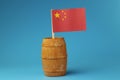 A view on national flag of China on wooden stick on wooden barrel